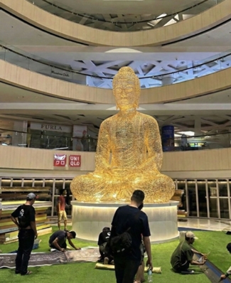 Buddha sculpture in mall atrium